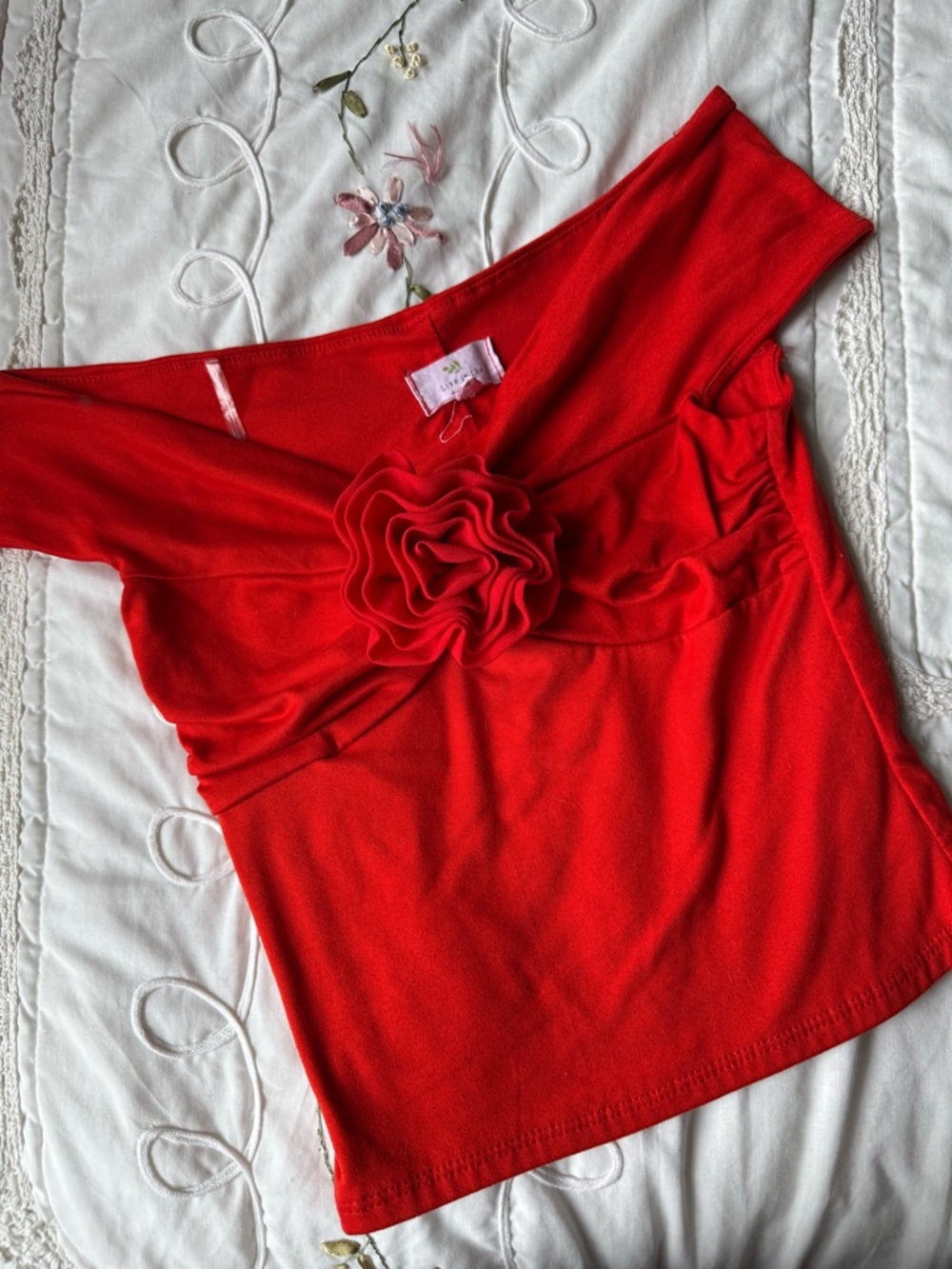 Red Off-Shoulder Top with Floral Rosette